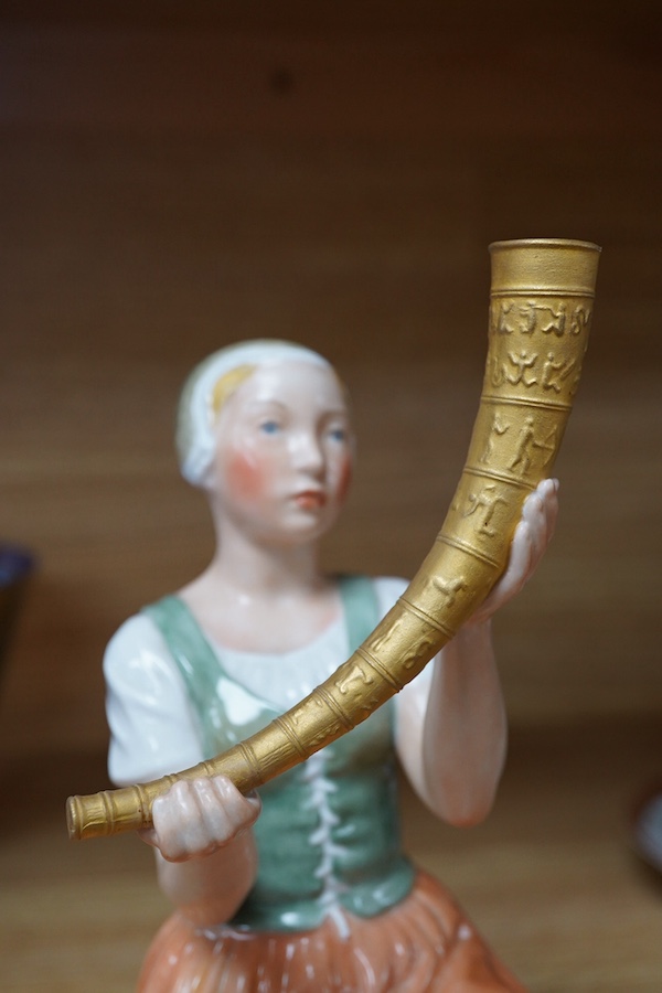 A Royal Copenhagen figure of Kristine Svendsdatter, carrying the gilded horn of Gallahus, numbered 12242, 21cm high. Condition - good